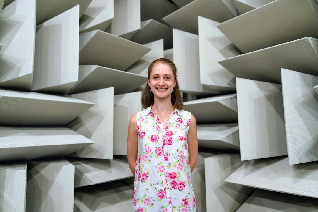 Studio portrait of a woman researcher smiling